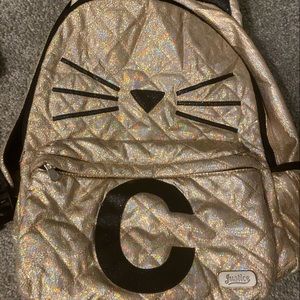 justice backpack with the letter C